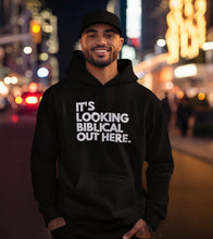 Load image into Gallery viewer, It’s Looking Biblical Out Here Hoodie
